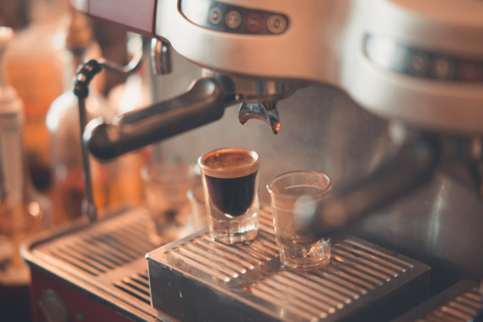 selective focus photography of espresso machine